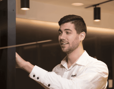 An SSW employee touching the SophieHub display