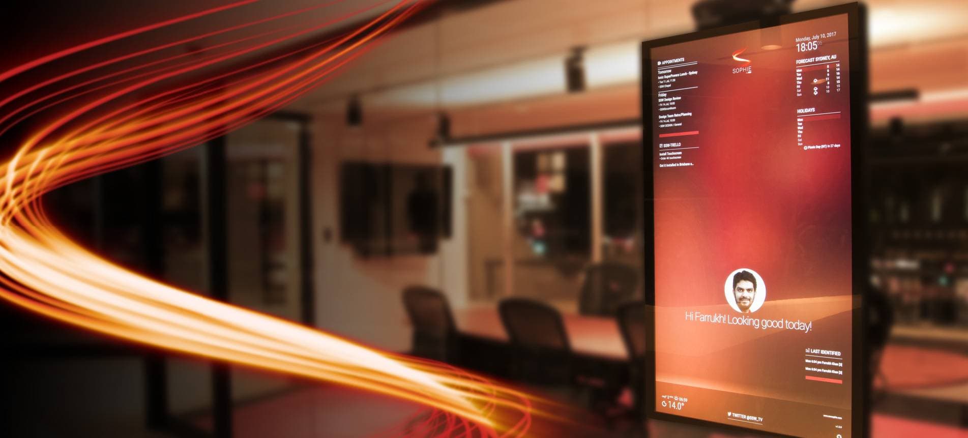 The SophieHub display in an SSW office, greeting a staff member by name and showing their appointments, the weather and holidays